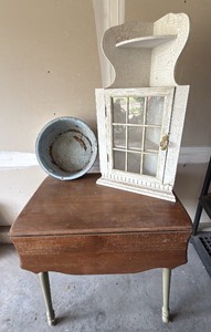 vintage drop leaf table, metal pan, and white shelf