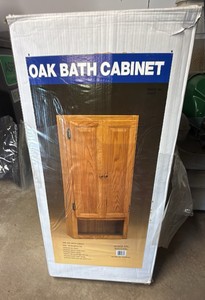 Oak bath cabinet in original box size is 18 x 36 x 7 deep made by Sunco