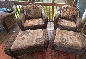 Two all season wicker chairs with foot stools