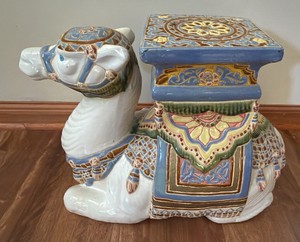 vintage Hollywood Regency Moorish-style ceramic camel plant stand features a vibrant polychrome glazed finish and a square top.