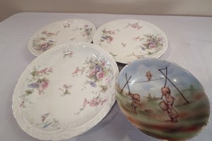 Royal RUDOLSTADT Kewpie doll bowl along with three Haviland Limoges plates