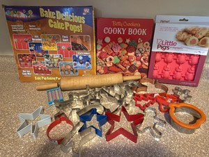 Betty Crocker cookie book,   rolling pin, cookie cutters, and cake pop molds