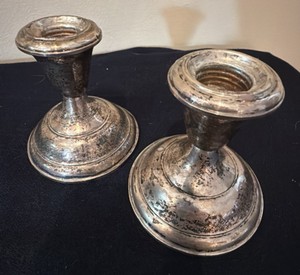 two sterling silver candlesticks