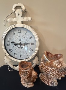 anchor style decorative clock and Pottery fish