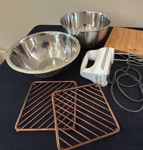 brass trivets, five speed KitchenAid mixer, and metal bowls