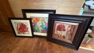 three framed floral pictures