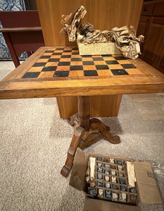 wooden chess and checker table with two sets of hand-carved stone or onyx game pieces
