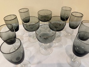 vintage smoke grey crystal stemware with clear stems, appearing to be Gorham Midnight Mist or similar mid-century modern glassware featuring smoked bowls and clear bases