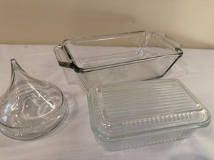 Vintage clear ribbed glass refrigerator butter or casserole dish with matching lid, Pyrex loaf pan, and a glass KISS