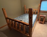 cabin style log full size bed with with beauty rest, Gemini extra firm mattress and boxspring plus a side table