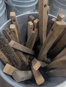 Assorted Wooden Handle Brushes in Bucket