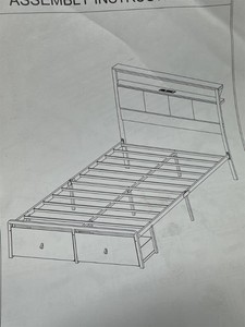 Twin bed with shelves and lights.