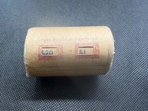 Unopened 20 coin roll of Morgan silver dollars with an 1895 at one end and an O Mint Mark at the other end