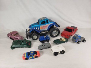 Lot of Die-Cast and Other Toy Vehicles including Monster Truck, Race Car, and Vintage Models