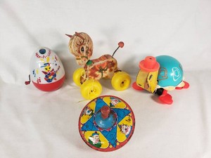 Vintage Childrens Toys including Peek-a-Boo Musical Toy, Pull-Along Horse, Tortoise, and Spinning Top