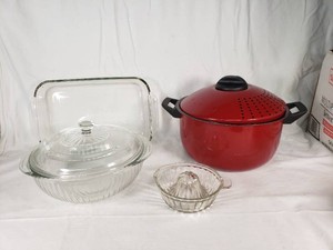 Pyrex and Red Cookware including Rectangular Pyrex Baking Dish, Glass Casserole with Lid, Red Stockpot with Lid, and Glass Citrus Juicer