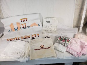 Assorted Embroidery and Textile Items with Stauffer Seeds Bag, Pillowcases, and Decorated Linens