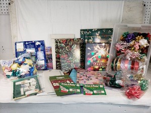 Holiday Gift Wrapping Supplies Including Wrapping Paper, Ribbons, and Bows