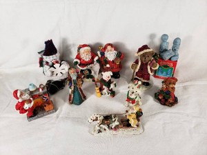 Christmas Figurine Collection featuring Santa Clauses, Teddy Bears, and Dogs
