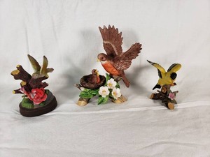 Decorative Bird Figurines including Hummingbird with Rose and Two Other Bird Sculptures