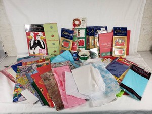 Holiday Gift Wrapping Supplies Including Cleo Elite Foil Stamped Tags, Penguin Money Holders, Gift Trims, and Assorted Wrapping Papers