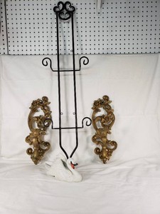 Black Metal Easel, Gold Decorative Wall Sconces, and Porcelain Swan Figurine