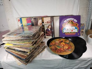 Collection of Vintage Vinyl Records Including Frankie Valli, Disney, and Dolly Parton