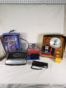 Kinyo VHS Automatic 2-Way Video Rewinder, Citizen Kinaret (anakinra) AMFM Radio Stereo Cassette Player, Canon IX240 Camera ELPH Jr., Kodak Star 110 Camera, Kodak Brownie Hawkeye Camera Flash Model Set