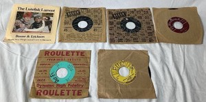Collection of Vintage 45 Records - Includes Patsy Cline, Bill Haley and His Comets, Johnny Cash, Ritchie Valens, The Crickets, and Boone & Erickson