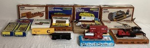 Tyco Train Cars HO Scale and Accessories Including Gondola with Logs Pine Hill, Operating Log Loader, Operating Crane Car with Boom Tender. 16 Boxes Included