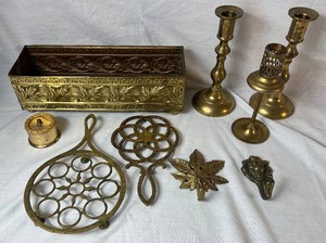 Assortment of Brass Candlesticks, Trivets, Hooks and Planter