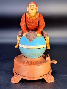 Vintage Style Clown on Globe Cast Iron Mechanical Bank - Mint Condition &amp Fully Functional