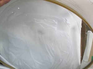 Brass framed 42 round mirror...