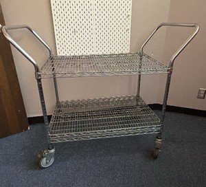 Baker rack on wheels can be converted into three shelvesd