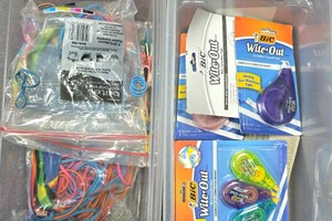 Bin of white out and rubber bands