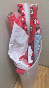 used rolls of Christmas gift wrapping paper