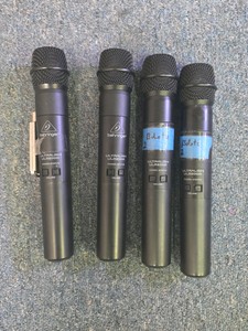 set of four wireless microphones