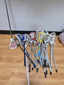 lot of lacrosse sticks