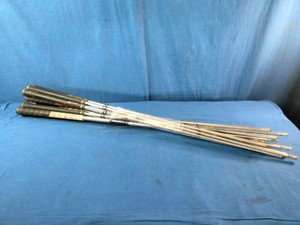 Steel iron shafts for golf clubs bundled together.