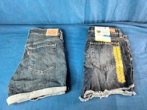 Levis cuffed mid-rise denim shorts and Seven7 raw-hem distressed jean shorts with tags