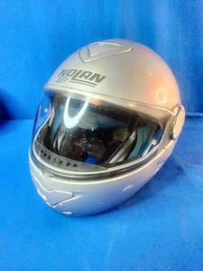 Nolan motorcycle helmet features a flip-up modular design