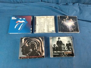 Collection of compact discs (CDs) by the legendary rock band The Rolling Stones.