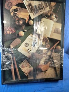 These are Golf I and Golf II wall art prints by artist Michael Harrison, featuring vintage golf clubs and memorabilia.