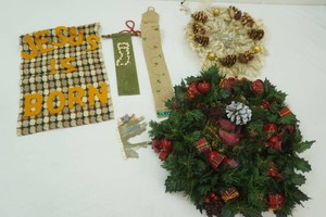 Christmas decor including wreaths, wall hangings