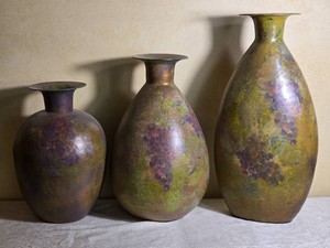 Set of Three Patinated Metal Grape Motif Floor Vases