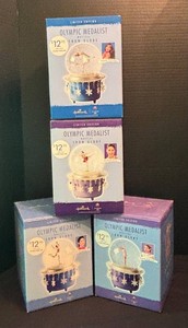 LR - Set of Four Hallmark Limited Edition Olympic Medalists Musical Snow Globes