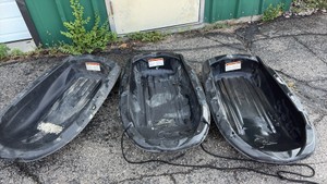 Three snow sleds