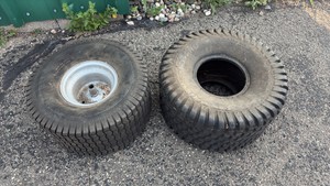 Pair of lawnmower tires one with rim