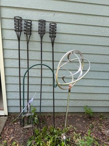 Assorted Tiki Torch Holders and Garden Decor