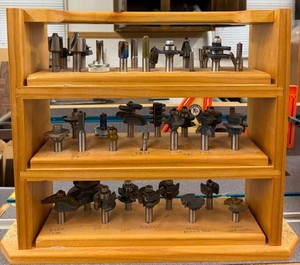 Assorted Router Bits in Wooden Rack